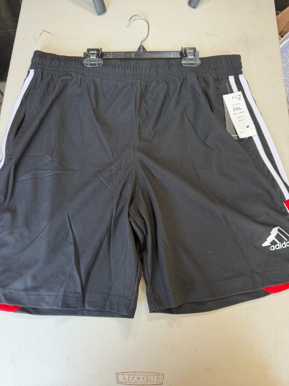 adidas Black Athletic Shorts with White Stripes and Red Accents